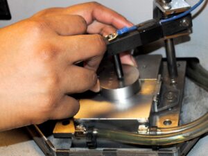 Metal sample prepared for OES analysis