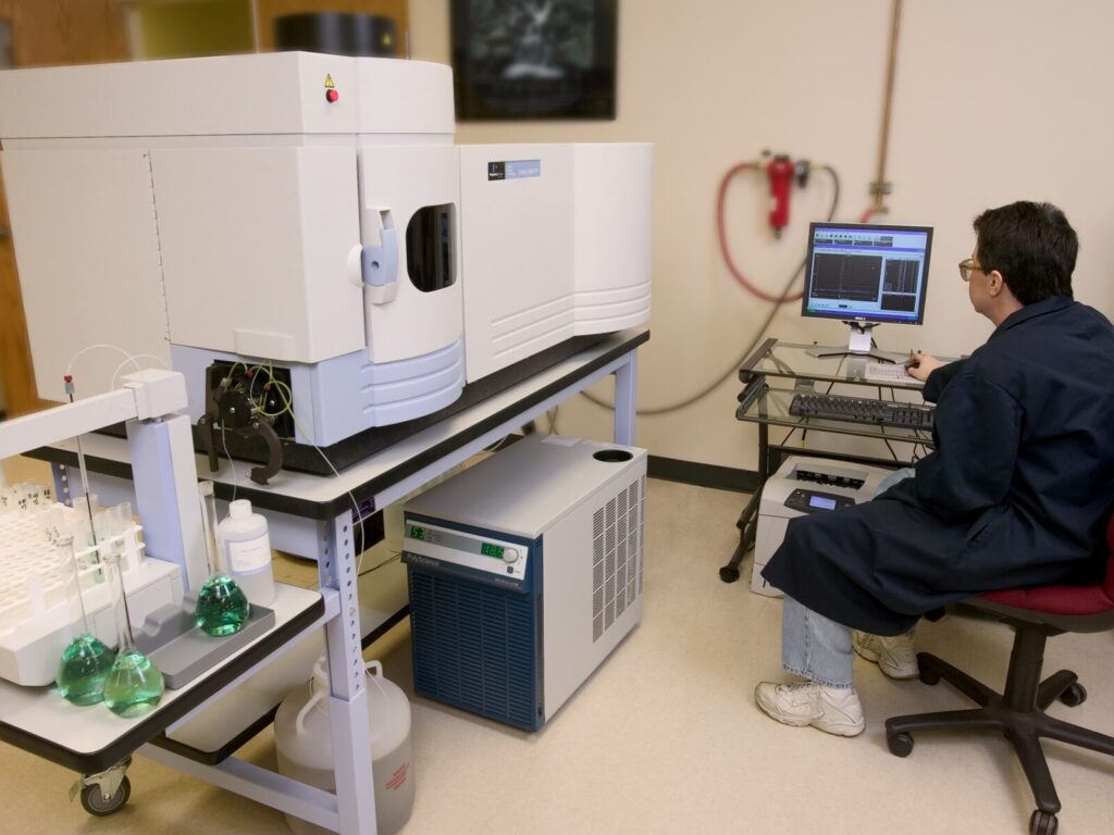 Chemist tests a product for harmful chemicals using Optical Emission Spectrometry.