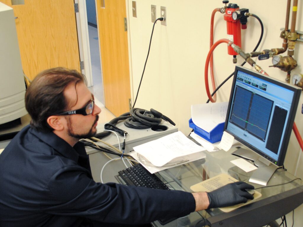 Chemist studies the results of Inductively Coupled Plasma testing.