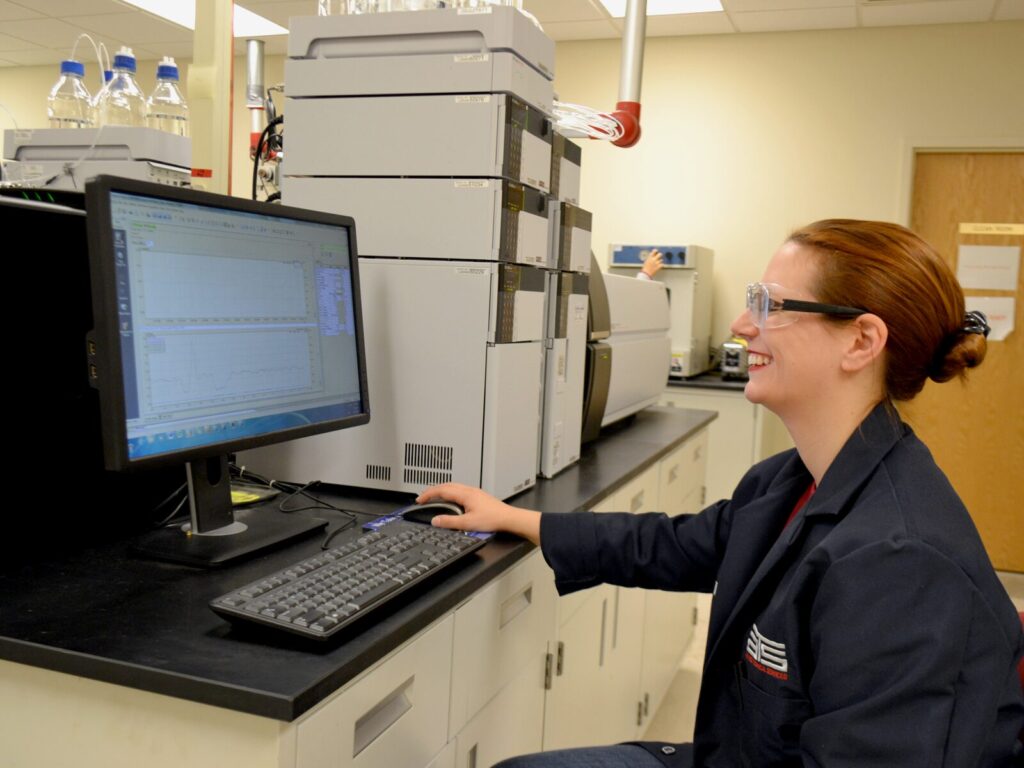 Chemist analyzes the results of Liquid Chromatography and Mass Spectroscopy on a computer screen