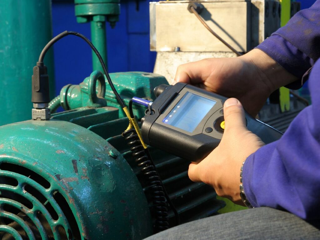 Reliability expert performs vibration analysis on a motor