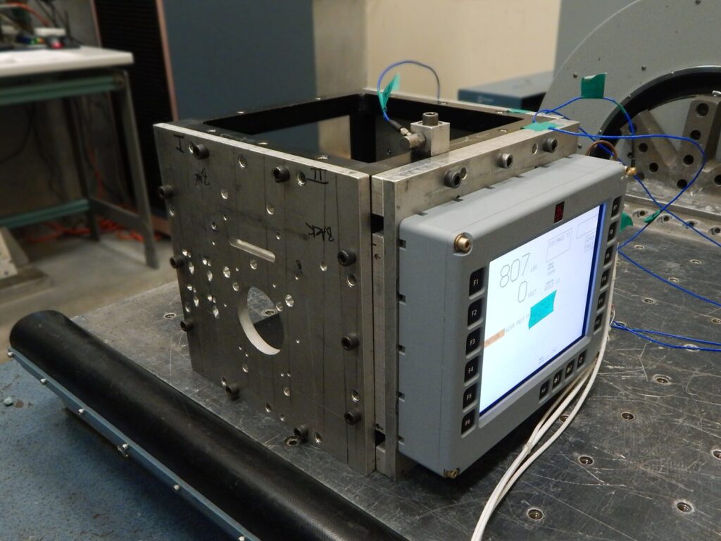 Mechanical component on a vibration table for random vibration analysis