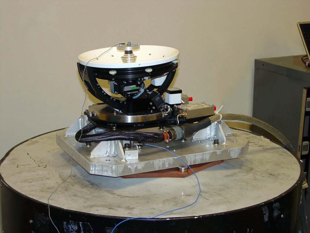 A satellite strapped to a shaker table for vibration table