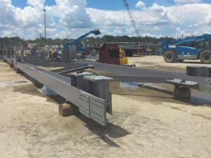 Mechanical testing experts inspect a downed truss system