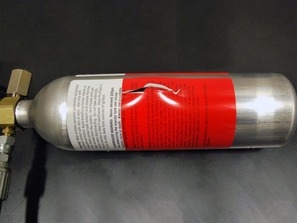 Compressed air canister with a rupture