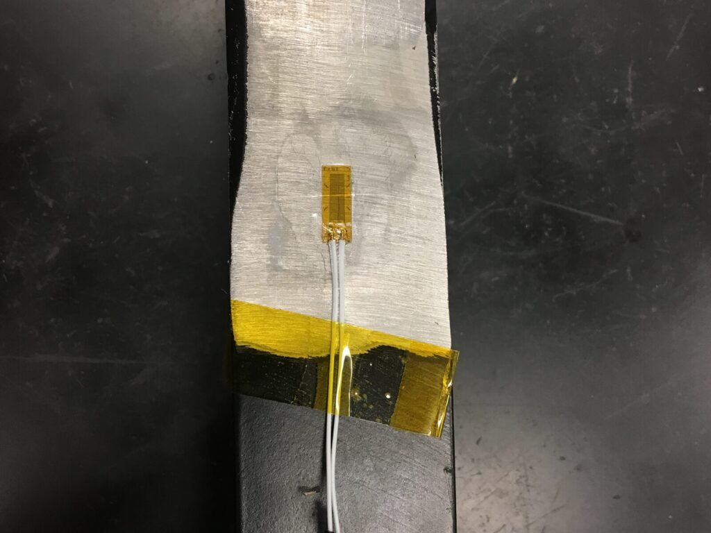 Electrical wire on foil for strain gauge testing