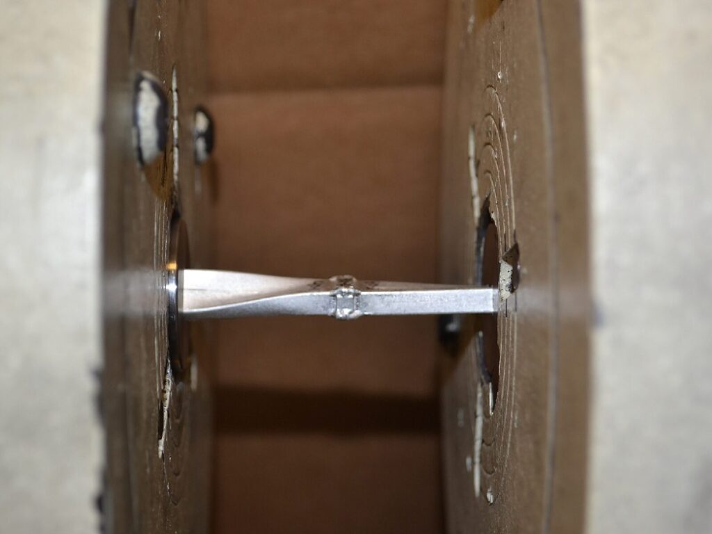 Twisted metal sample after torque testing
