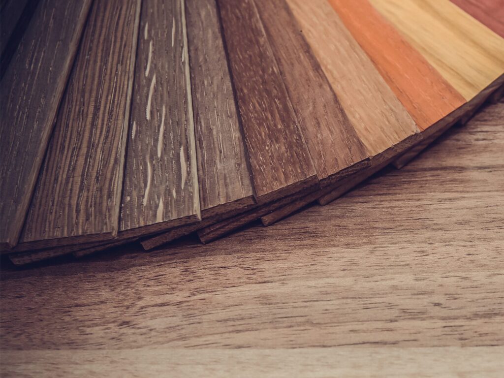 Close up of hardwood floor samples treated with furfuryl alcohol
