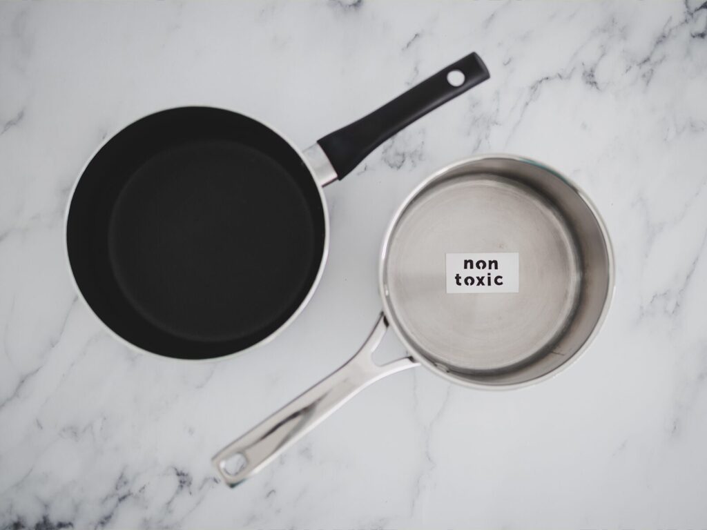 A cooking pot and pan. The pot has a sticker that says "Non-toxic" on the inside.