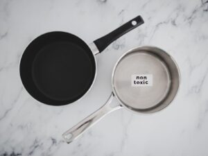 A cooking pot and pan. The pot has a sticker that says "Non-toxic" on the inside.