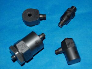 Four accelerometers against a blue background