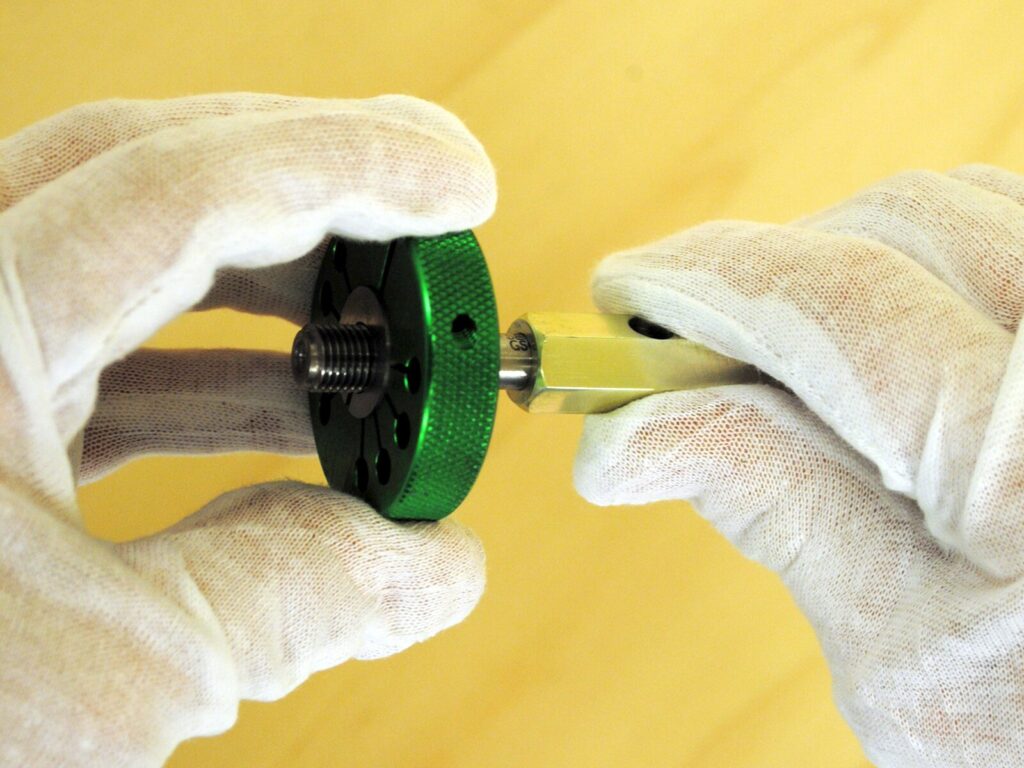Technician holds an adjustable thread gage