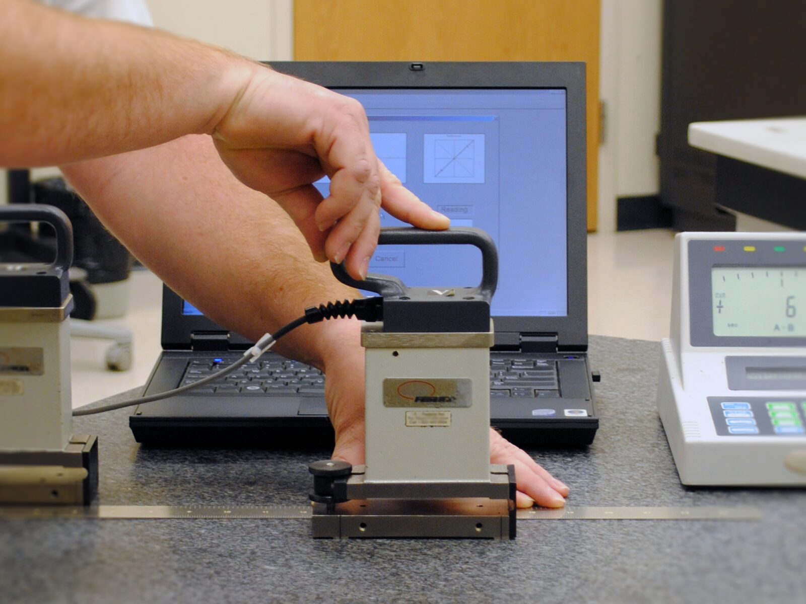 Technician calibrates surface plates