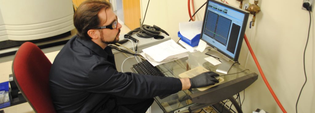 Chemist performing ICP Testing and Analysis on Alloy sample