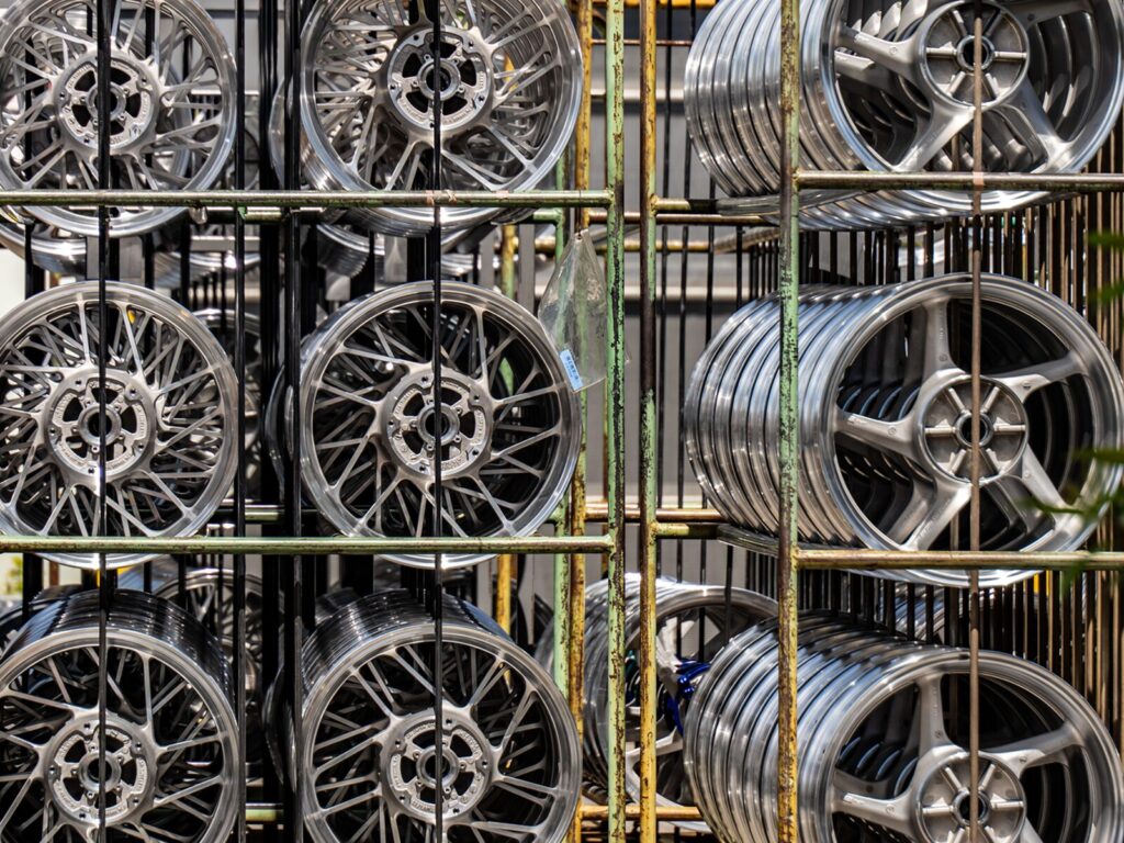 Stacks of aluminum wheels on display