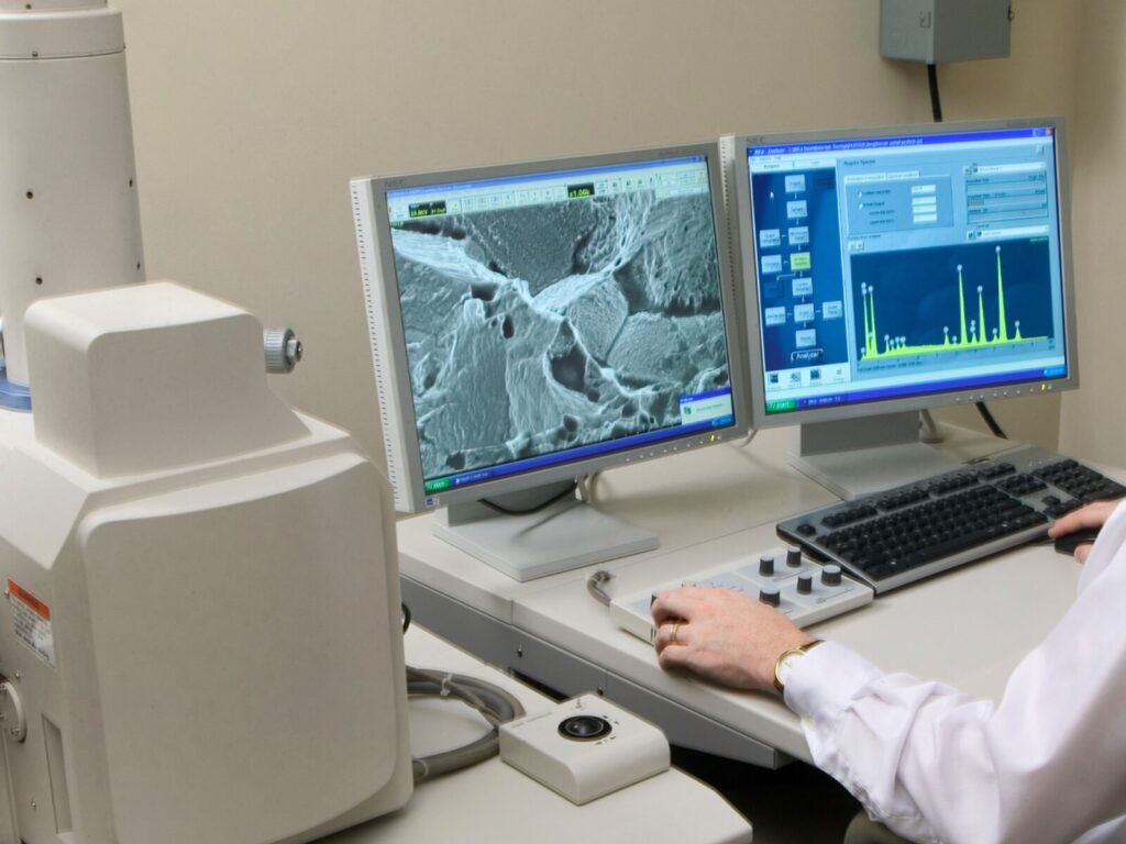 Chemist analyzes material with