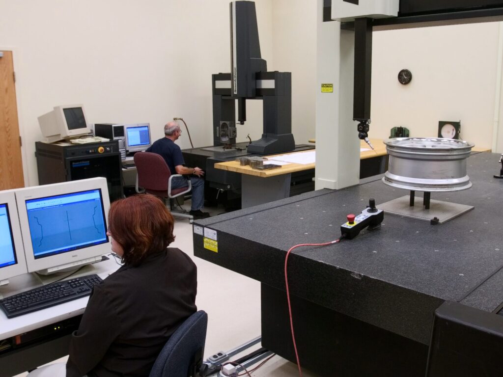 Two coordinate measuring machines and technicians in our lab