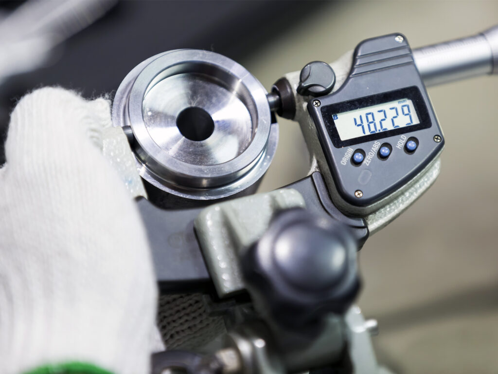 Expert prepares digital equipment in our calibration standards lab