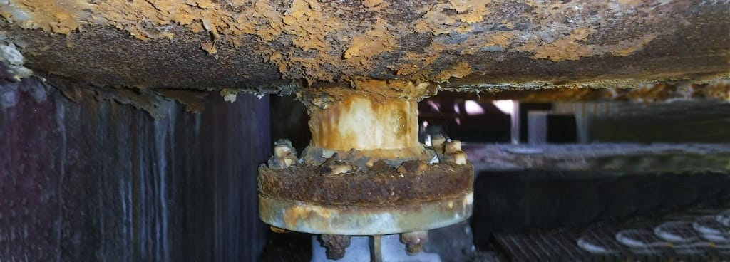 Rusted piping components under visual inspection