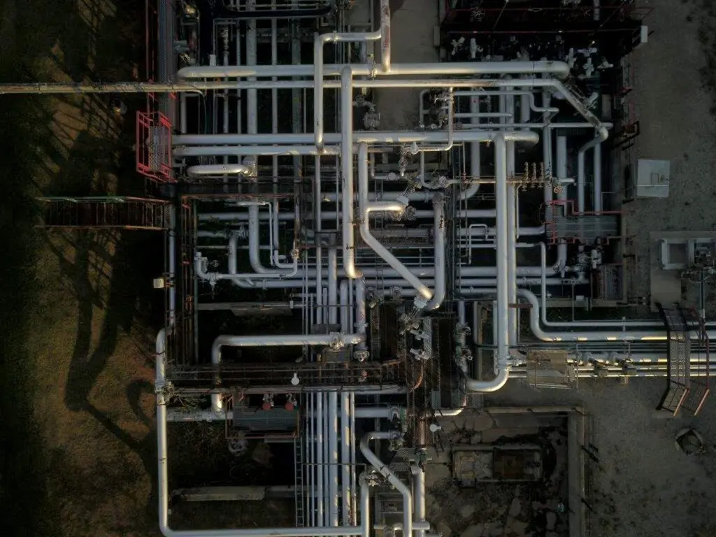 Aerial view of an above-ground pipeline at dawn. Photo taken with a drone.