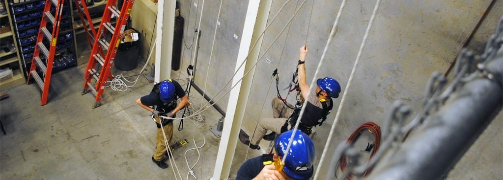 Training Coordinator Teaching Students How to Safely Use Their Ascenders