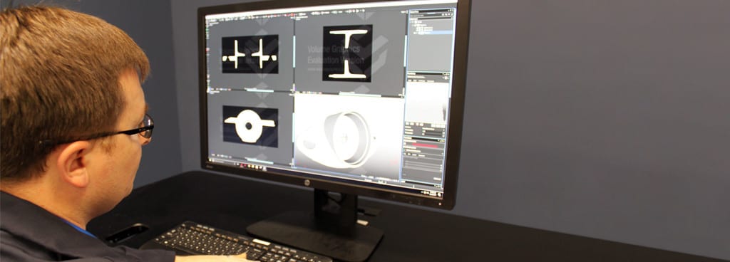 Technician Manipulating 3D CAD Models Generated Through CT