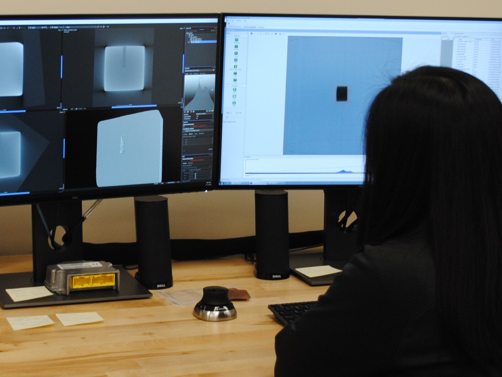 Woman studies an X-Ray on a computer screen