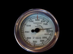Dial tachometer on a black background