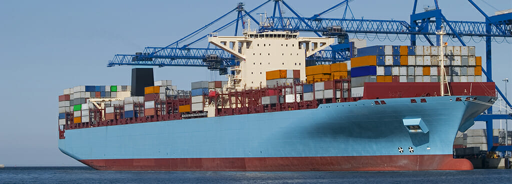 large red and light blue cargo ship eligible for marine services