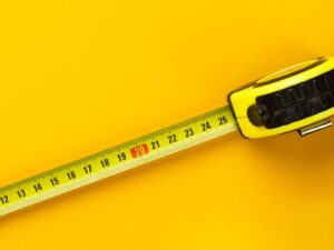 Tape measure on a yellow background
