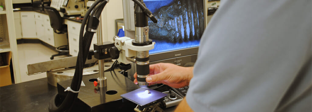 Technician Performing Digital Microscopy to See Materials Structure
