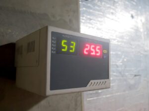 Digital hygrometer mounted to a wall