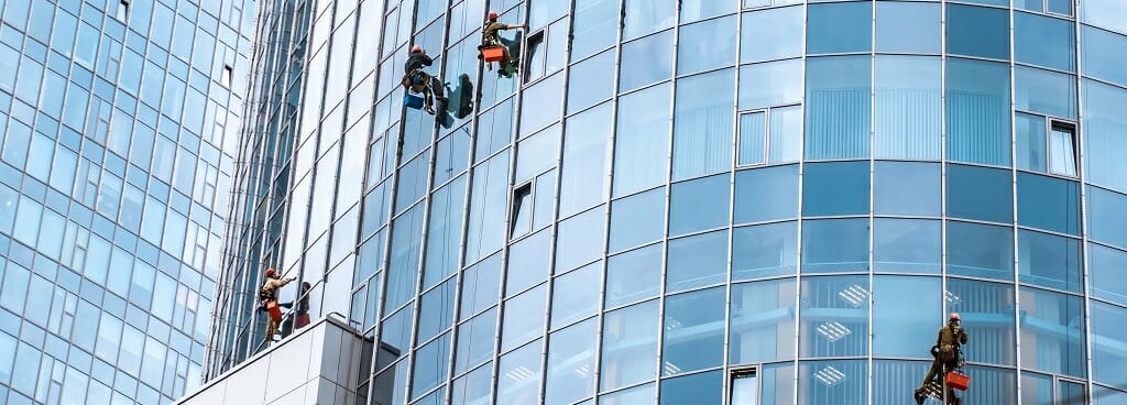 Window Cleaners Suspended from Rope Descent Systems
