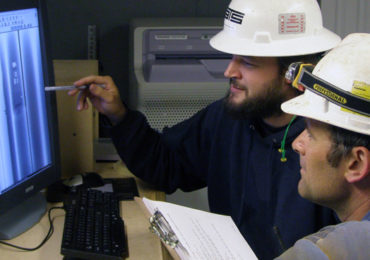 Technicians examining a radiograph