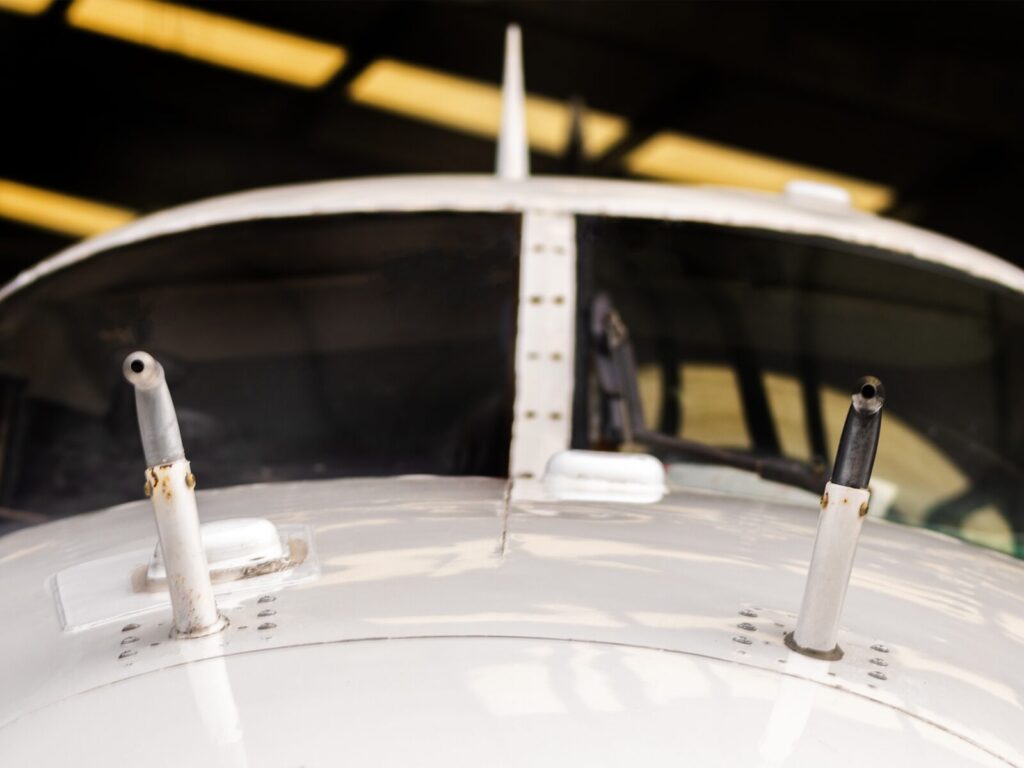 Front view of two pitot-static tubes mounted on an airplane