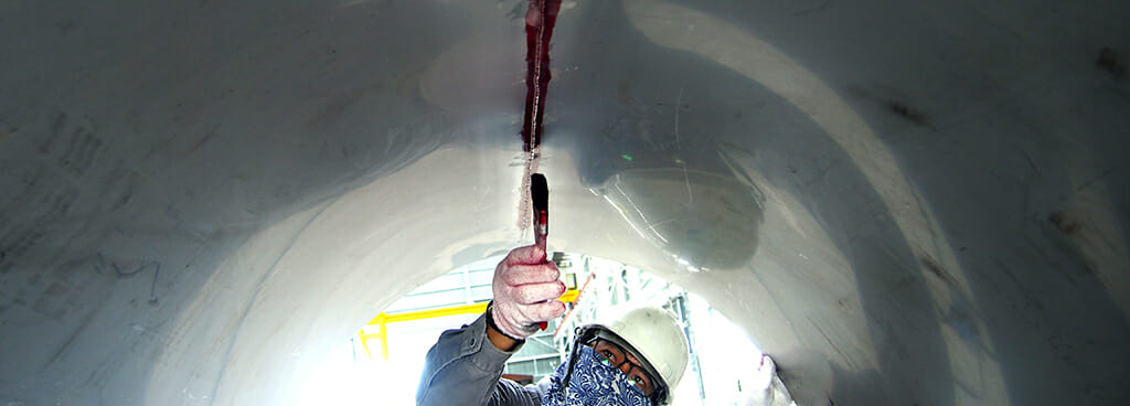 Technician Applying Liquid Penetrant Dye