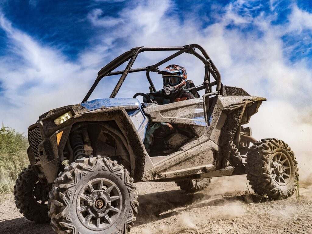 An all terrain vehicle (ATV) buggy in mud