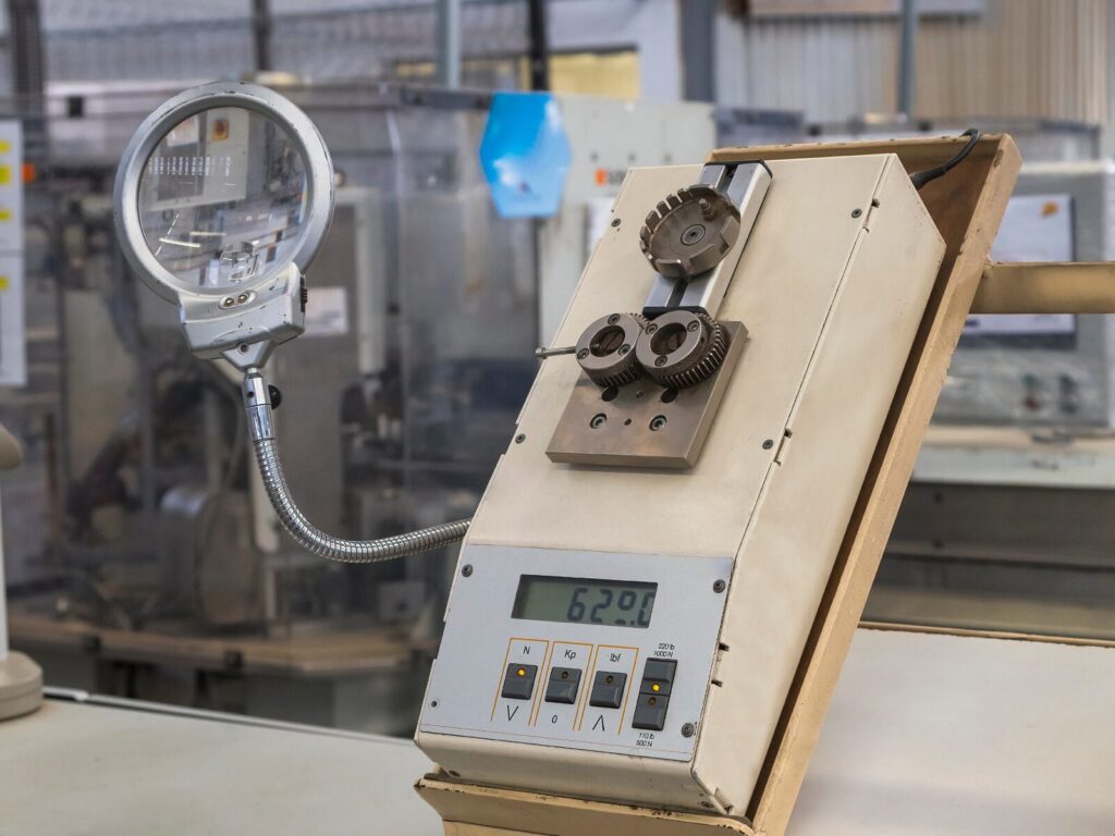 A wire crimp pull tester mounted on a tilted platform