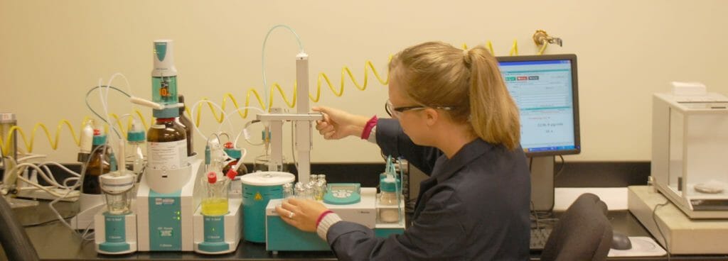 An expert performs consumer product testing in a CPSIA Testing Lab