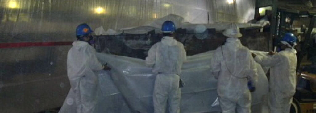 ATS asbestos abatement professionals seal off the area