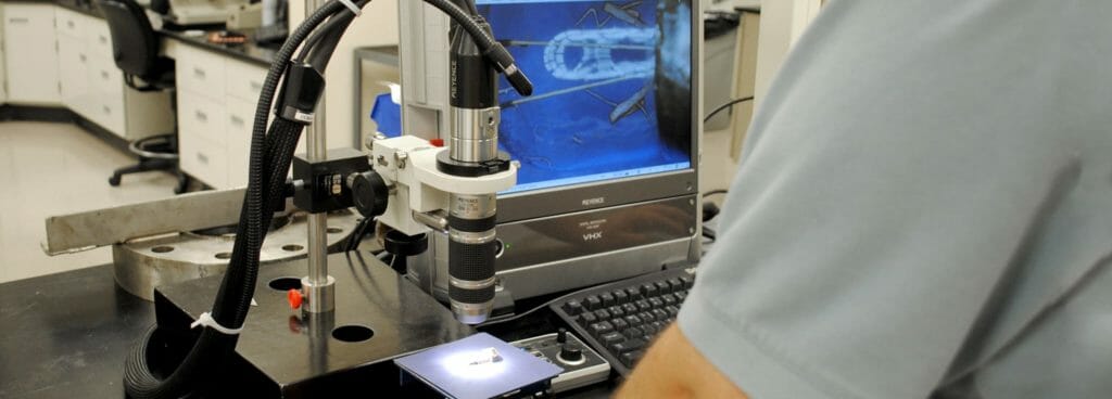 Polymer Fracture Analysis being conducted by a lab technician