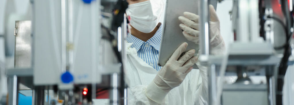 Medical Device Testing Expert Inspecting Equipment In A Laboratory Environment