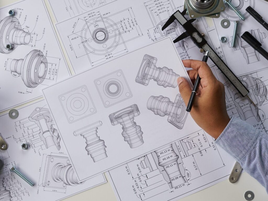 Forensic expert studies the blueprints and dimensions of a bearing
