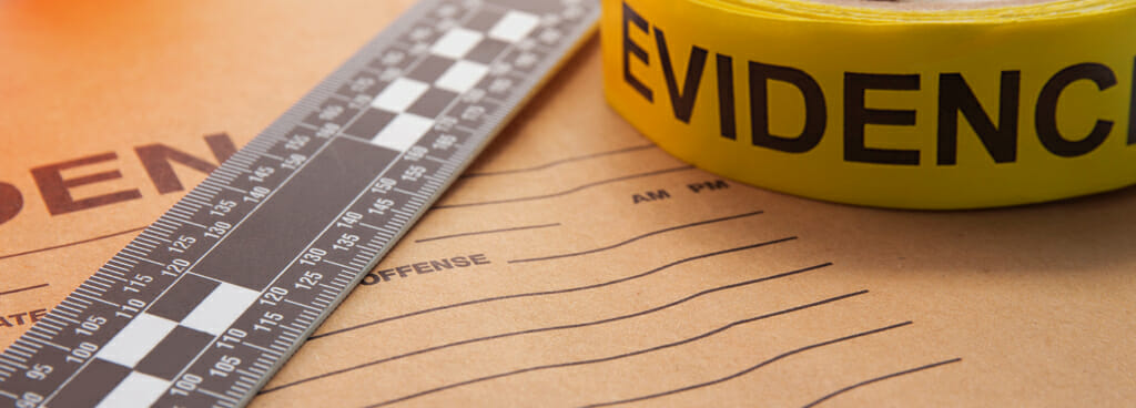 A ruler, evidence bag, and marker tape used by forensic companies