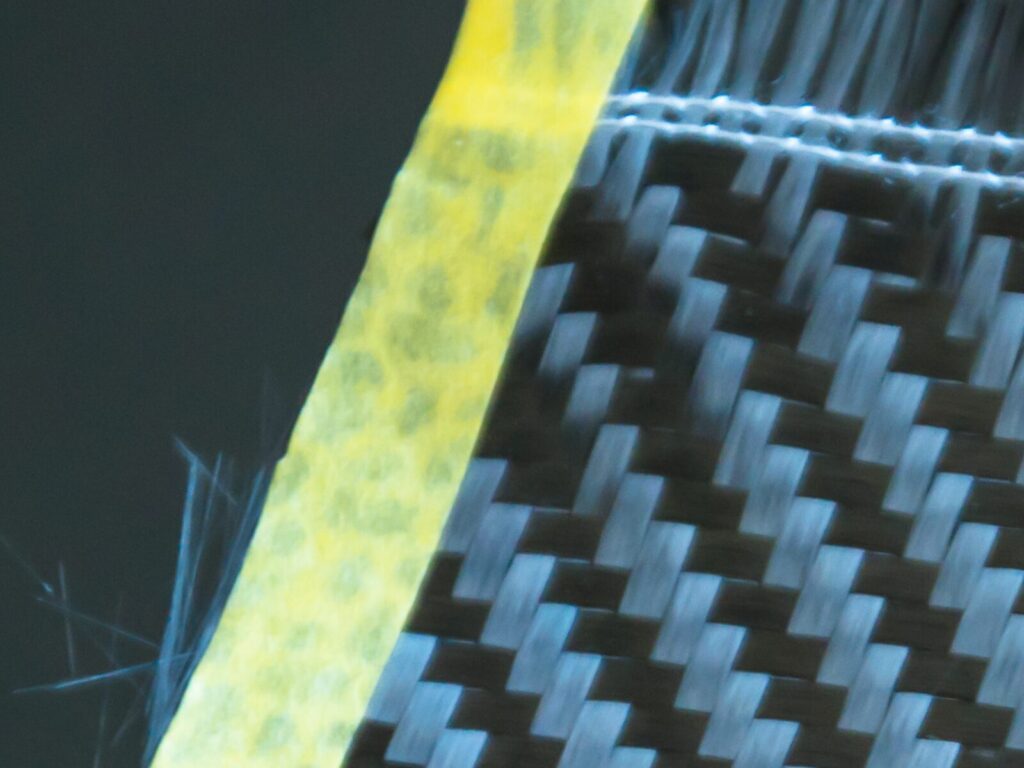 Fraying carbon fiber reinforced plastic sheet