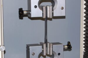 Tensile test machine with coupon