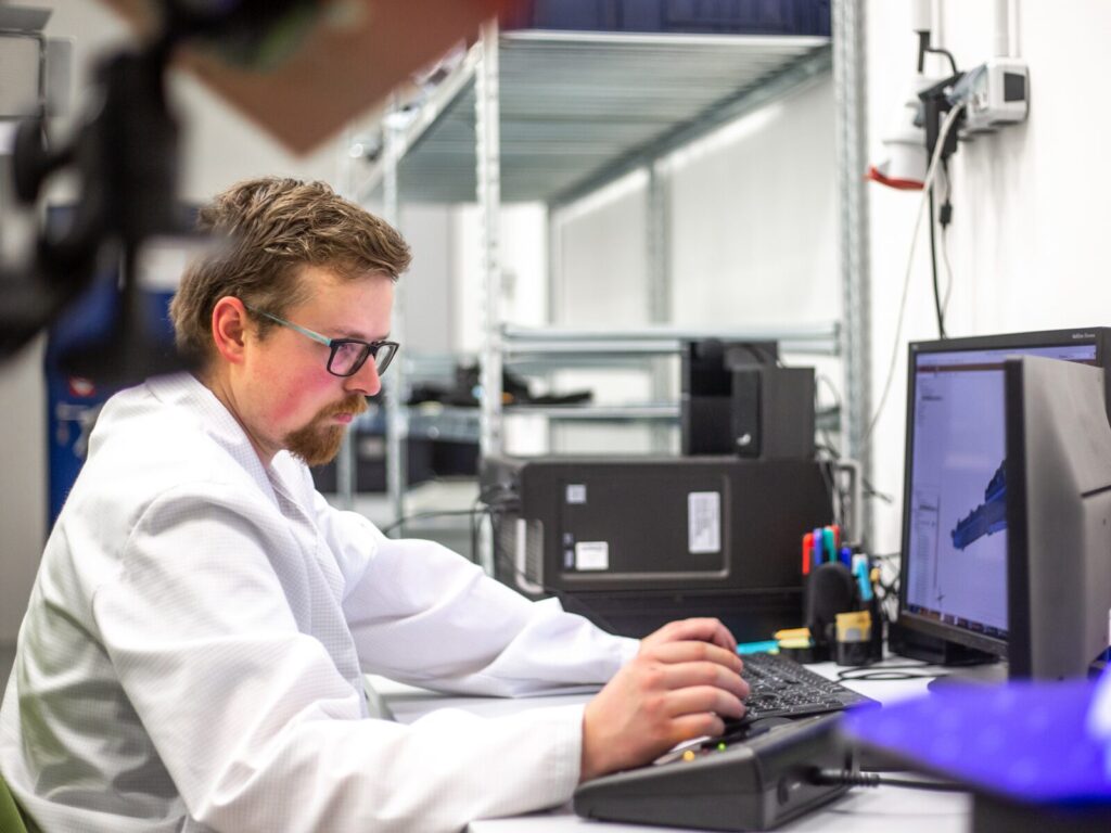 Man uses computer for reverse engineering