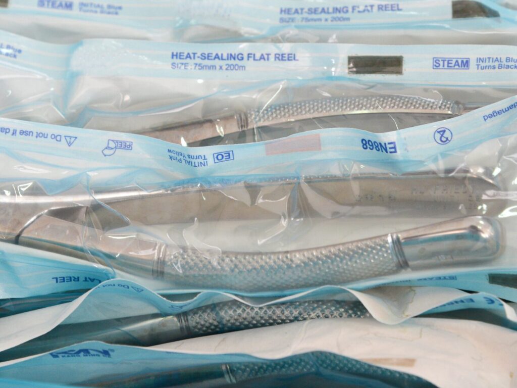 Heat-sealed and sterile packages for medical forceps