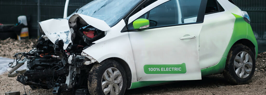 An electric vehicle's crushed hood after a collision. Saved from fire with battery impact testing to help design a resilient battery.
