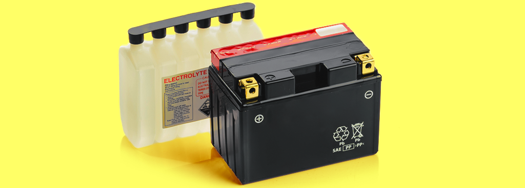 a valve-regulated lead-acid battery and electrolyte pack on a yellow gradient background